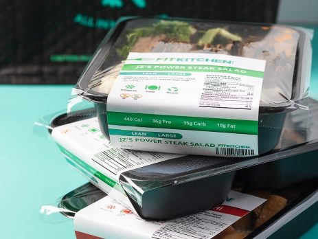 Stack of pre-packaged Fit Kitchen meals