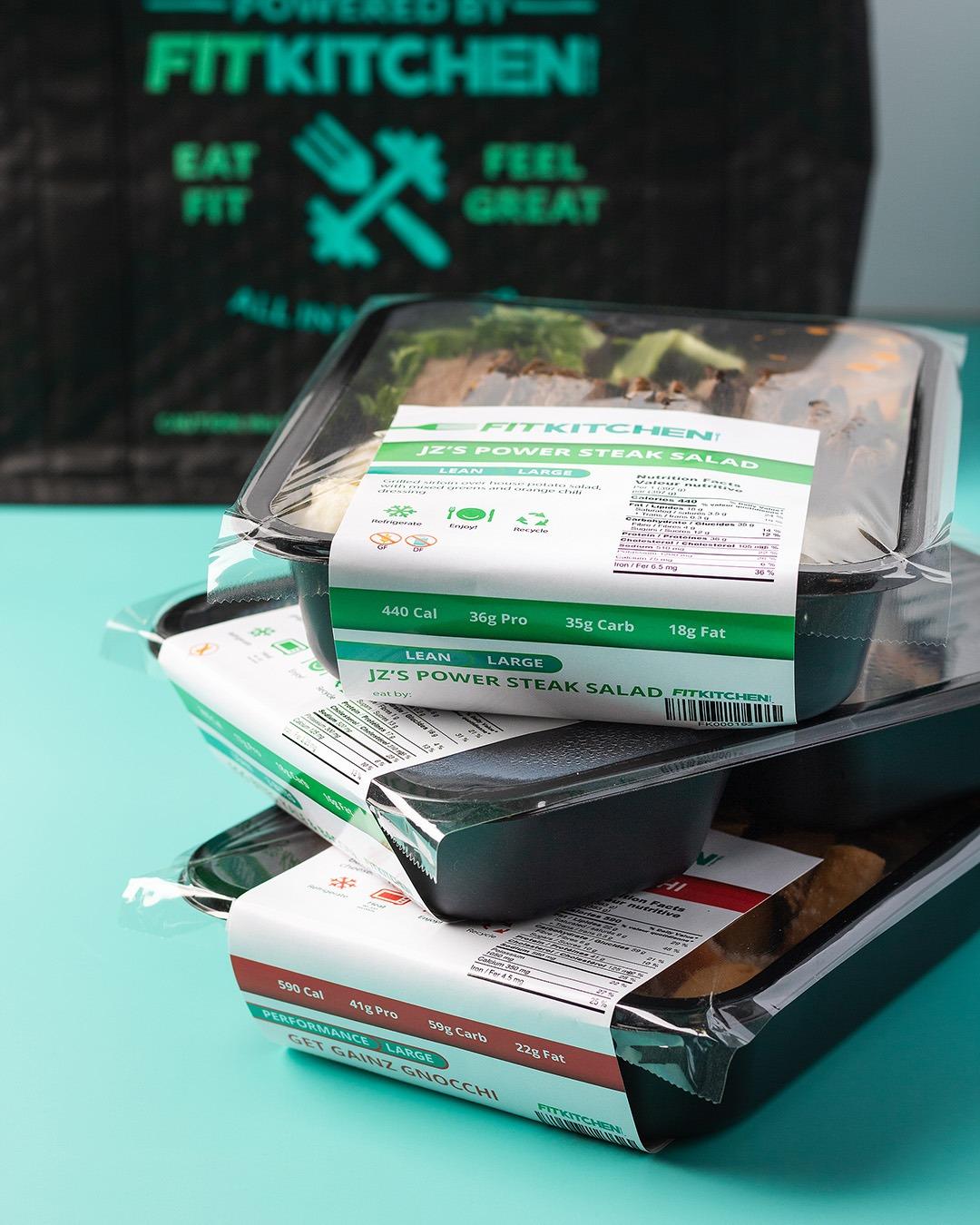 Stack of pre-packaged Fit Kitchen meals