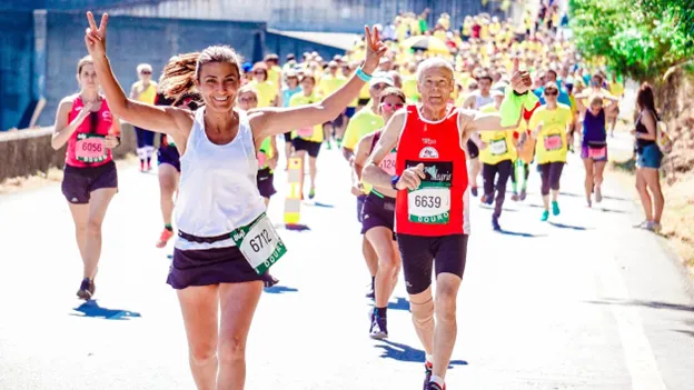 A group of runners participating in a marathon on a sunny day